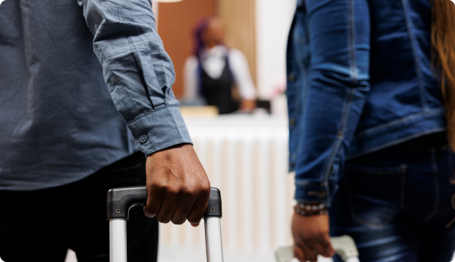 couple-pulling-luggage